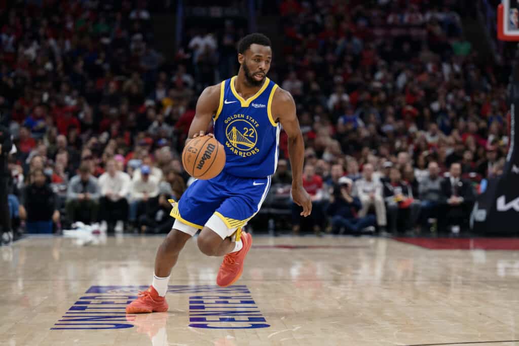 CHICAGO, ILLINOIS - JANUARY 12: Andrew Wiggins #22 of the Golden State Warriors controls the ball against the Chicago Bulls on January 12, 2024 at United Center in Chicago, Illinois. NOTE TO USER: User expressly acknowledges and agrees that, by downloading and or using this photograph, User is consenting to the terms and conditions of the Getty Images License Agreement.
